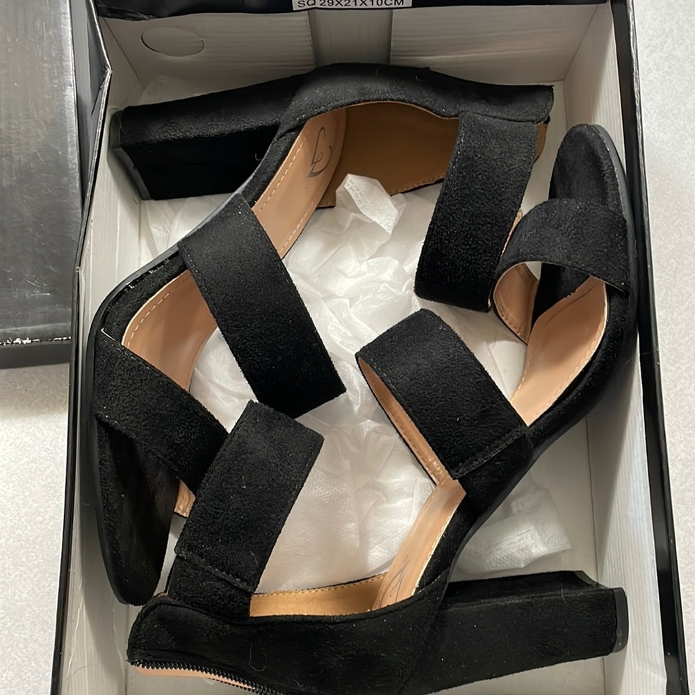 Black strapped heels, size 8. Never worn.